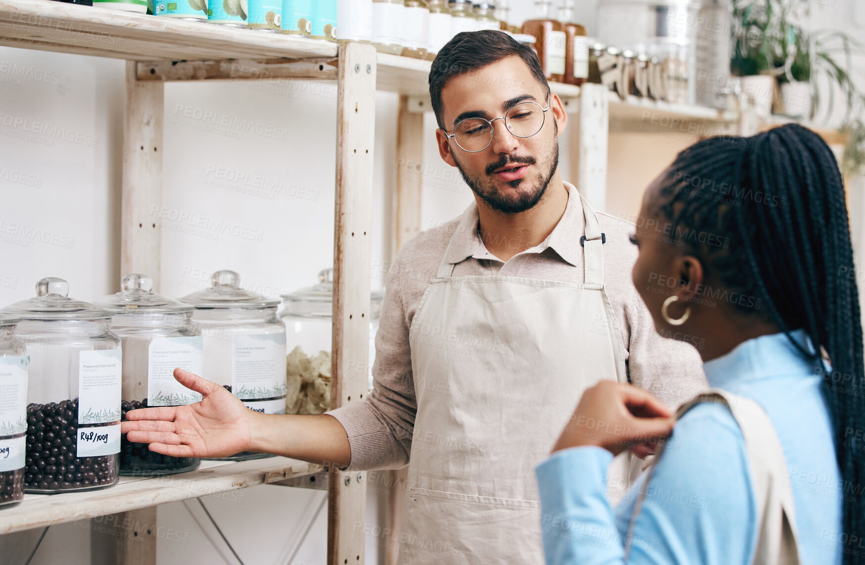 Buy stock photo Supermarket, grocery store and manager with woman for help, assistance and service in eco friendly market. Small business, organic shop and man with customer for groceries, product and food choice