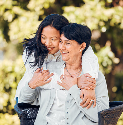 Mature mother, daughter and hug in garden with love on mothers day or woman bonding with care for mom in retirement. Happy, family and embrace outdoor, backyard or together on holiday or vacation