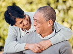 Love, smile and senior couple hug in a park with care, bond and enjoying relationship outdoor. Happy, romance and old people embrace in forest having fun with retirement, freedom or weekend in nature