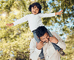 Father, portrait or piggyback with child in park for fun bonding, games or energy in backyard garden. Smile, airplane or playing dad carrying boy kid with parent, family or support activity in nature