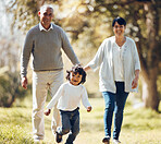 Happy, running and grandparent&rsquo;s with child in park for playing, love and support. Care, smile and freedom with family walking on nature path for peace, summer vacation and happiness together