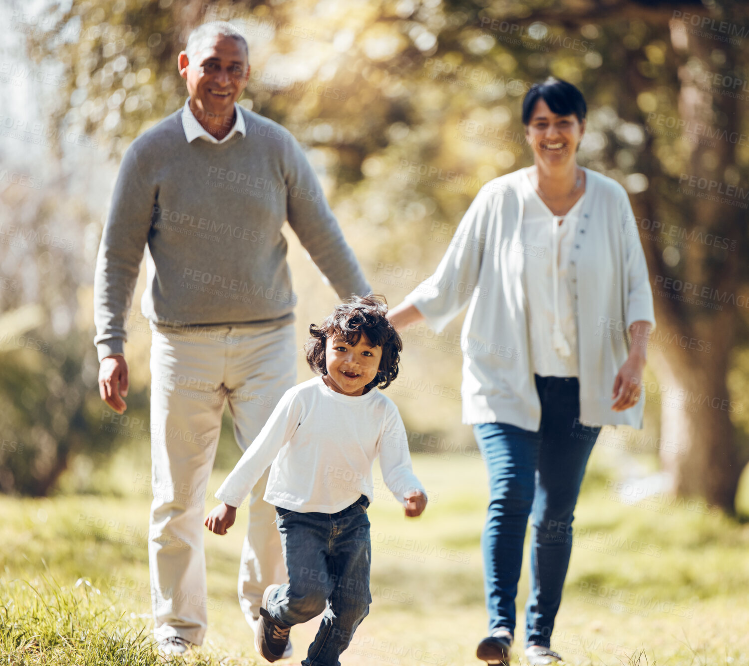 Buy stock photo Happy, running and grandparent’s with child in park for playing, love and support. Care, smile and freedom with family walking on nature path for peace, summer vacation and happiness together