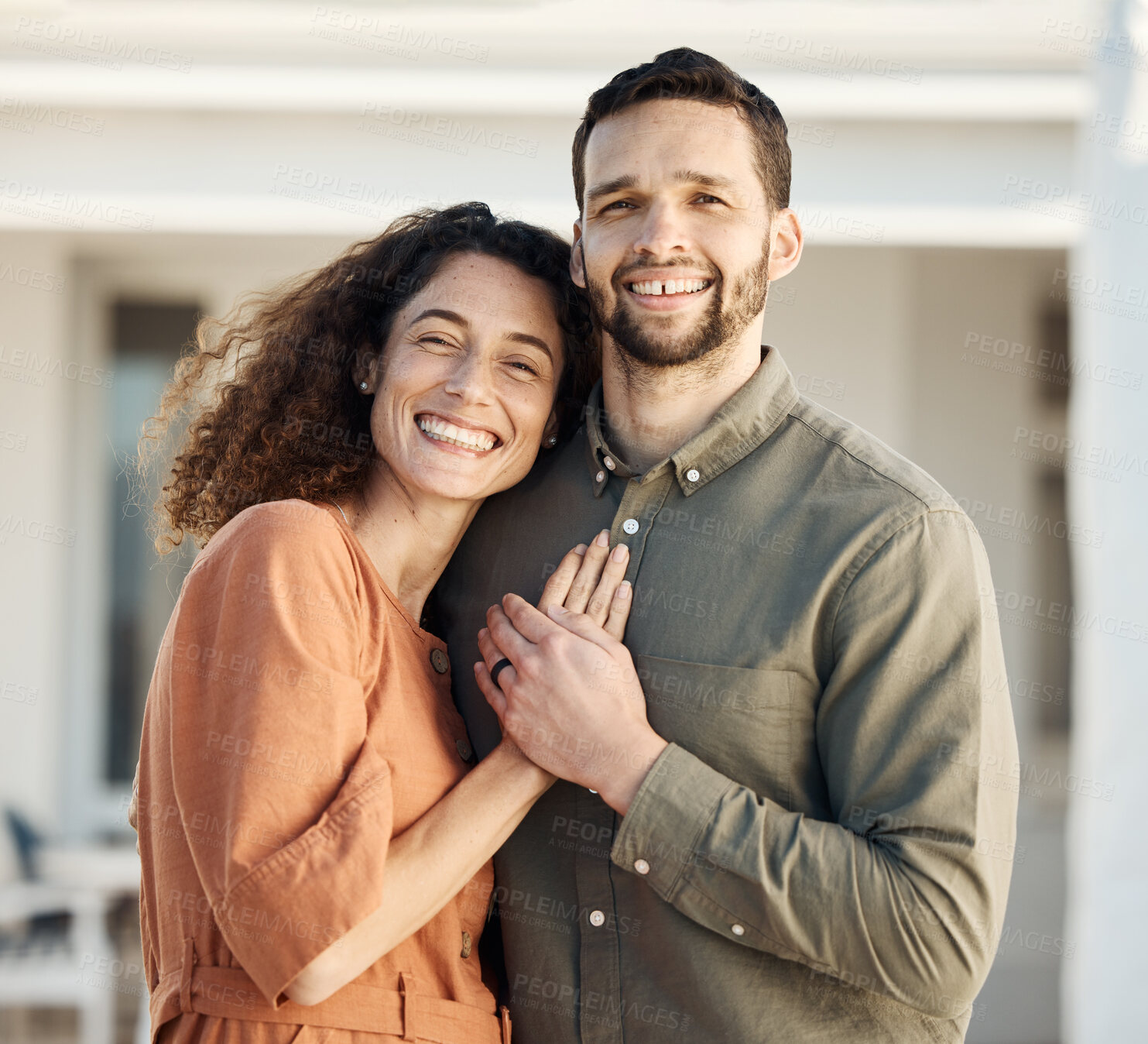 Buy stock photo Couple, hug and happiness outdoor in portrait, love and care with bonding, support and trust in a marriage. Life partner, laughing together and holding hands, people at home with respect and romance