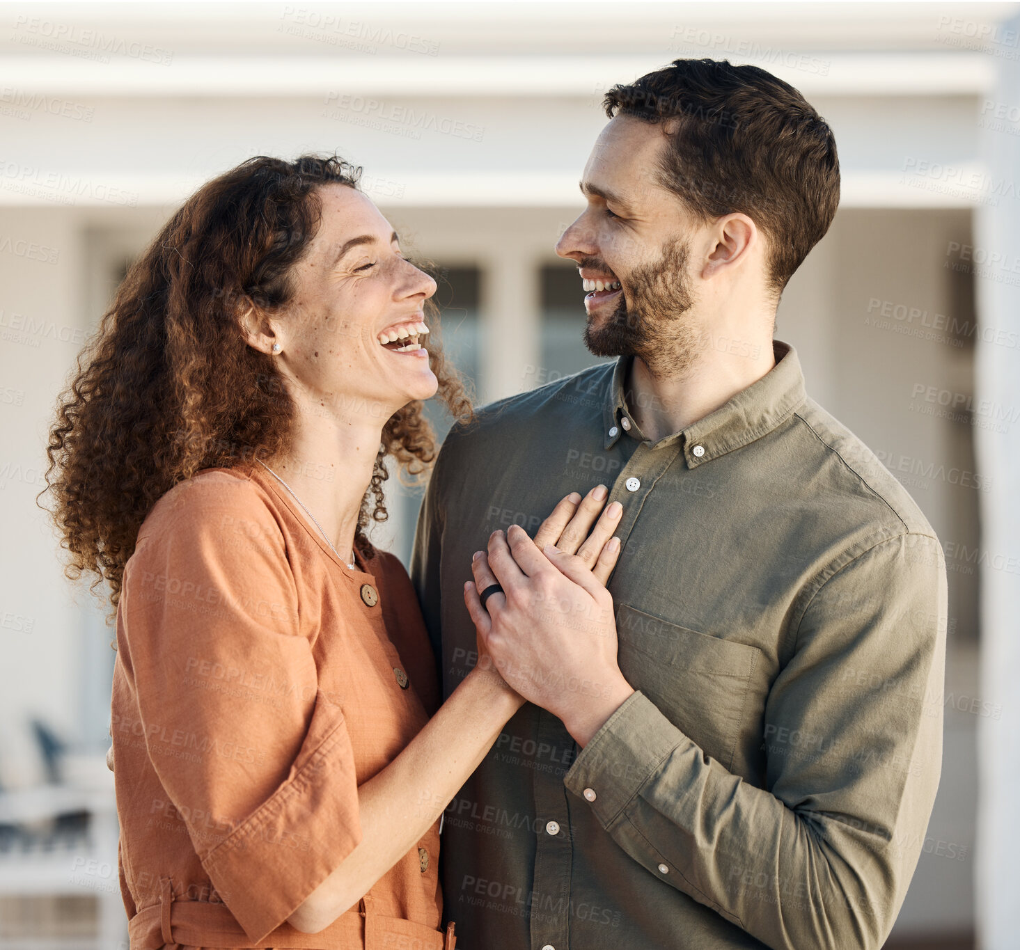 Buy stock photo Couple, hug and happiness outdoor, love and care with bonding, support and trust in a marriage. Life partner, laughing together and holding hands, people at holiday home with respect and romance