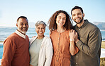 Portrait, couple and elderly parents at beach on holiday, vacation or travel. Face, family men and women at ocean for interracial connection, bonding and funny laugh together, smile and happy outdoor