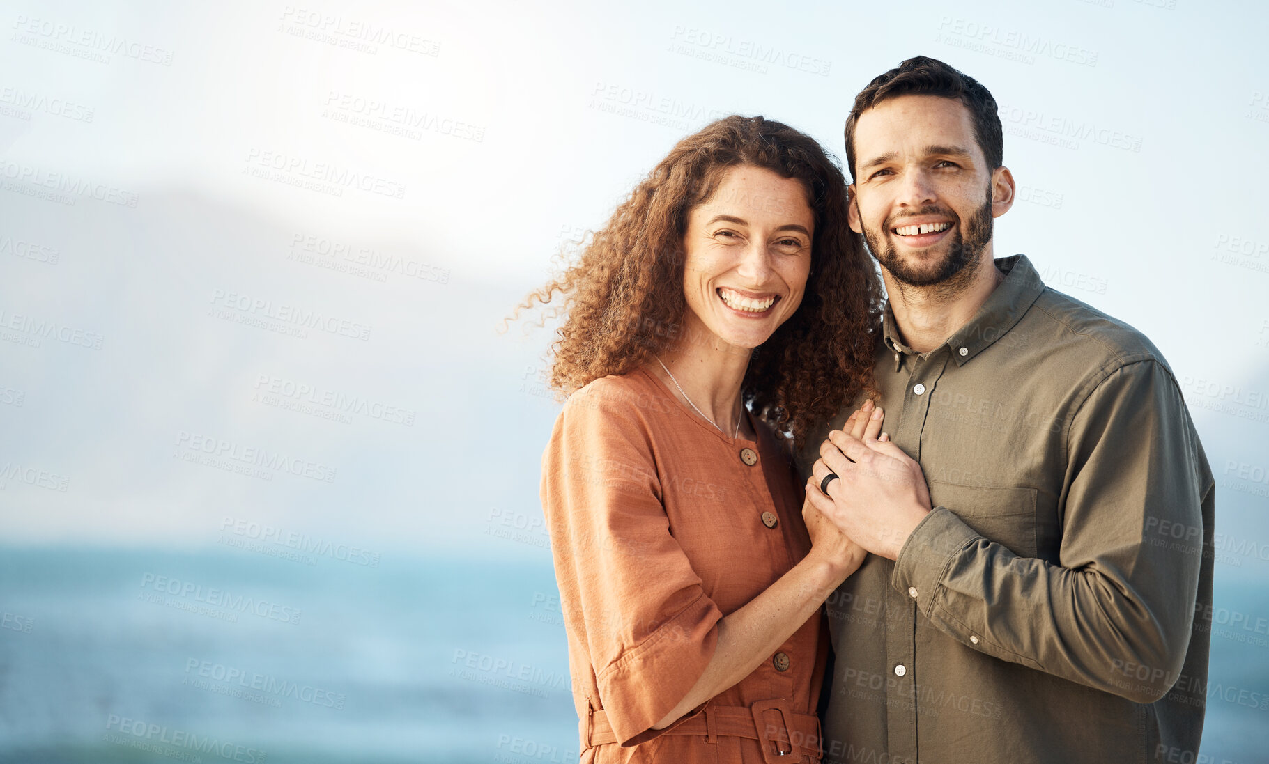 Buy stock photo Couple, hug and happiness at the beach, love and care with bonding, travel and trust in a marriage. Life partner, mockup space and adventure in nature, people on holiday with respect and romance