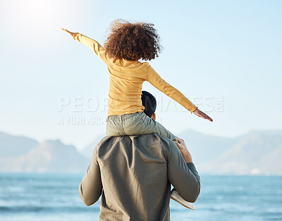 Buy stock photo Piggyback, kid and father at beach view on vacation, holiday and bonding on mockup space. Dad, play and carrying child at ocean, having fun and family travel to sea together in support, care or love