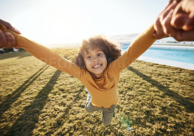 Buy stock photo Swing, pov portrait of girl and hands of parent in garden, spinning and circle movement kid on grass of home for play, love and happiness. Smile, relax and person flying for game and freedom