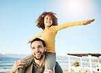 Father, kid and piggyback, freedom at beach with bonding and child on shoulders, fun and games together. Man, young girl and playful, summer and smile with love and adventure, parenting and childhood