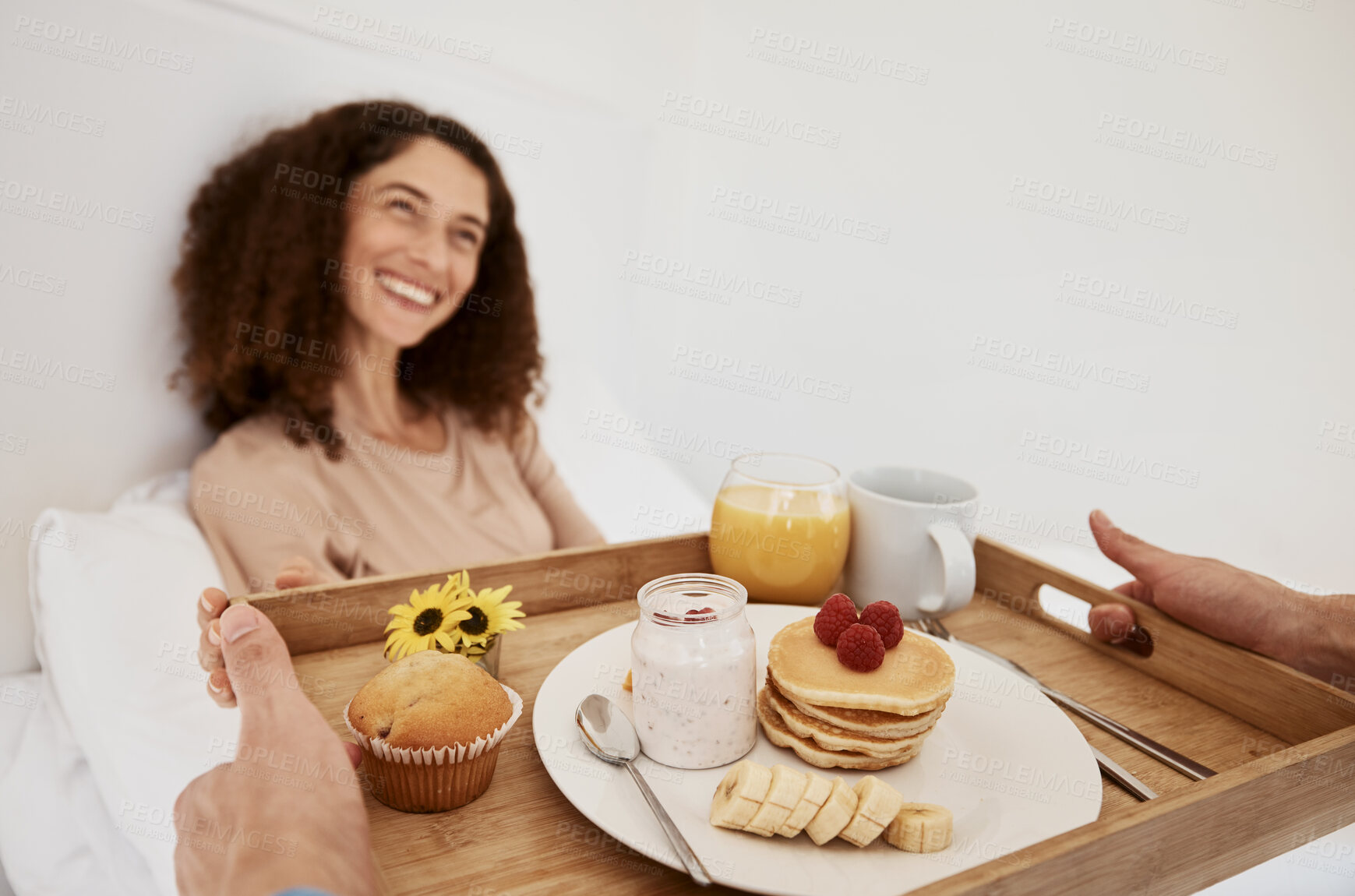 Buy stock photo Breakfast, romance and woman in bed for surprise, anniversary celebration and special birthday. Morning, love and happy couple with food, pancake and juice on tray for wellness, nutrition and hunger