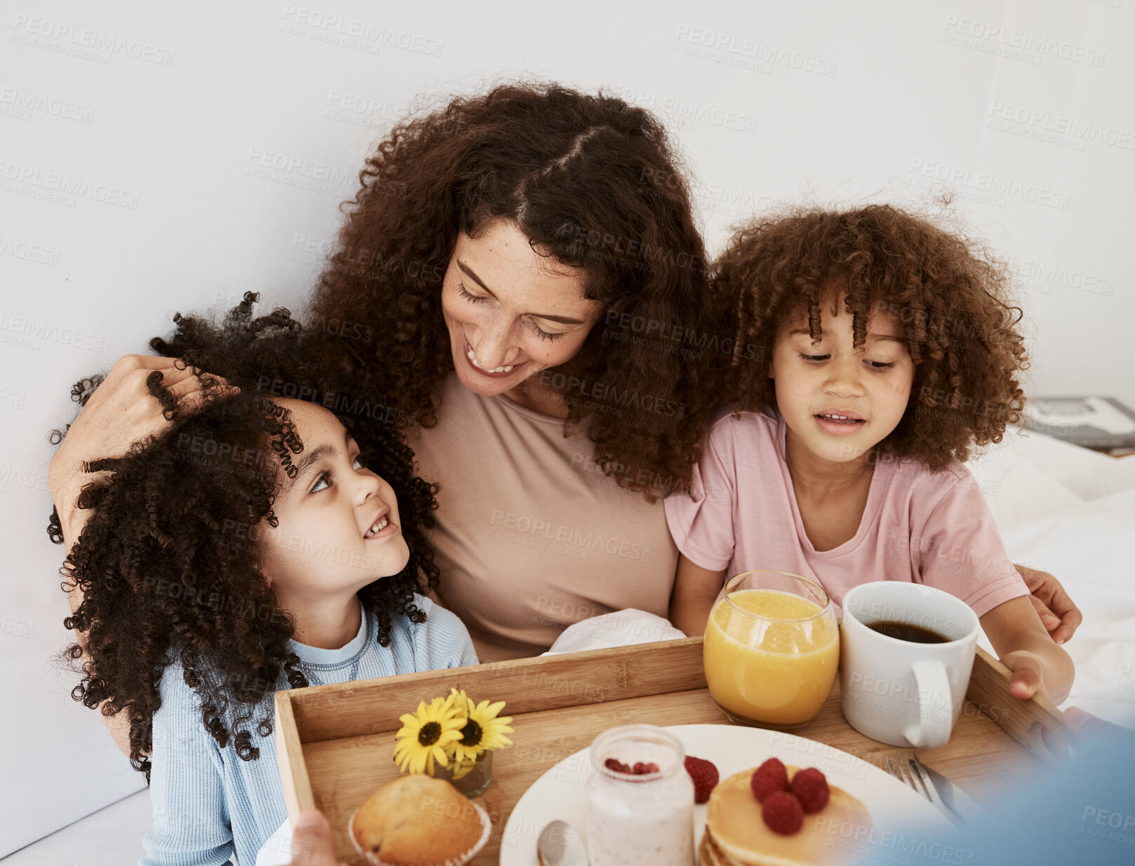 Buy stock photo Breakfast, mothers day and mom with kids in bed for birthday, celebration or special day. Interracial family, love and woman and children with healthy food on tray for wellness, nutrition or surprise