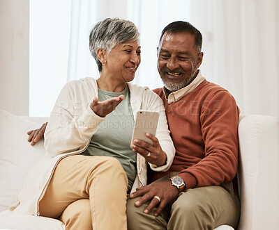 Buy stock photo Mature couple, phone and relax on a home sofa for search, internet and social media. Happy man and woman laugh together on couch with a smartphone for funny meme, online communication app or website