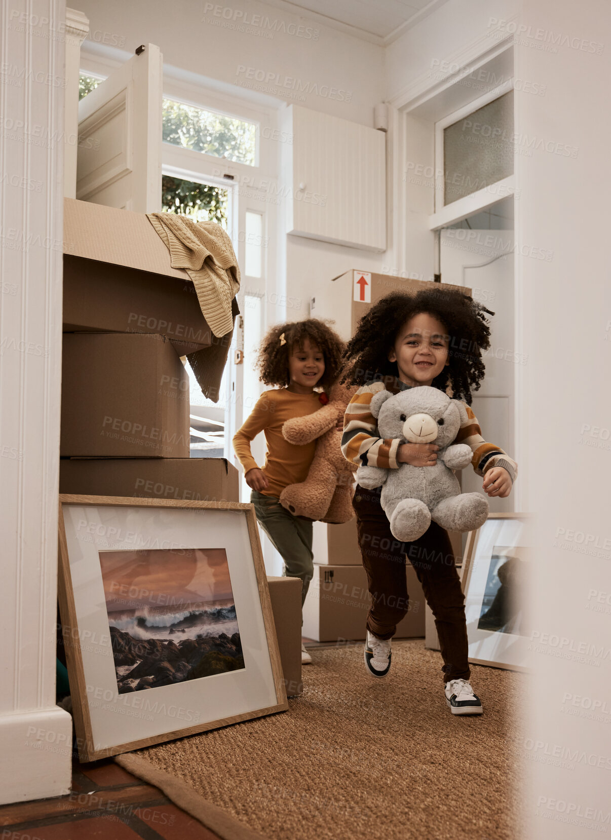 Buy stock photo Girl, children and happy in new home, running and toys with game, moving and excited for new beginning. Kids, teddy bear and playful with games at door in apartment, family house and freedom in lobby