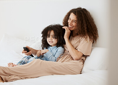 Buy stock photo Bedroom, happy family child and mother watching tv series, movie or streaming online video, cinema or entertainment. Home bed, kids and relax woman, mom or mama watch cartoon show, television or film