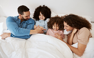 Buy stock photo Home bedroom, happy children and parents relax, laugh and bond with kids, rest and enjoy quality time together. Bed, youth and top view of mother, father or family wellness, love and morning care 