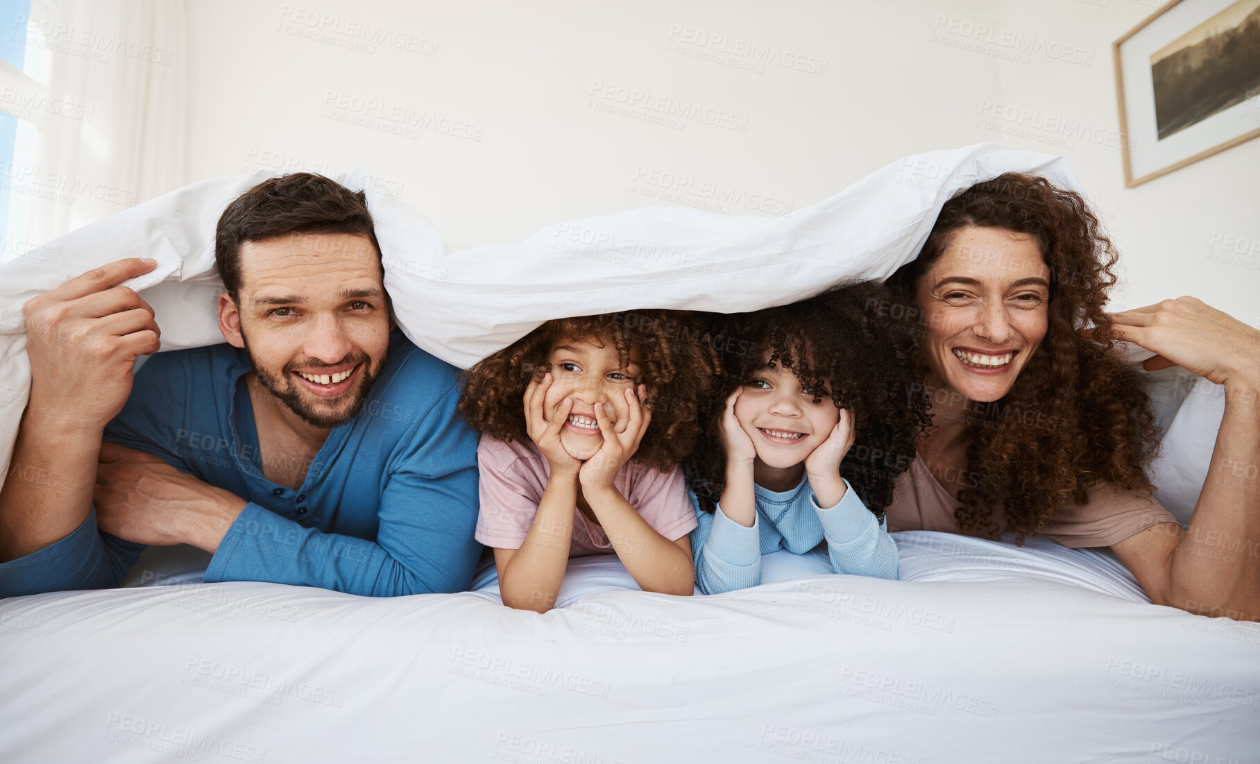 Buy stock photo Bedroom portrait, kids and parents happiness, bond or relax morning wellness, love and home comfort. Blanket, face or family mom, dad and interracial children happy, support or rest on bed mattress