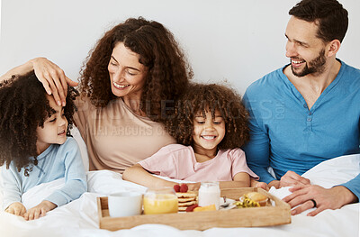 Buy stock photo Parents, children and breakfast in bed, morning or excited for love, bonding or care on holiday. Mother, father and kids in bedroom, food and smile together for nutrition, eating or happy family home