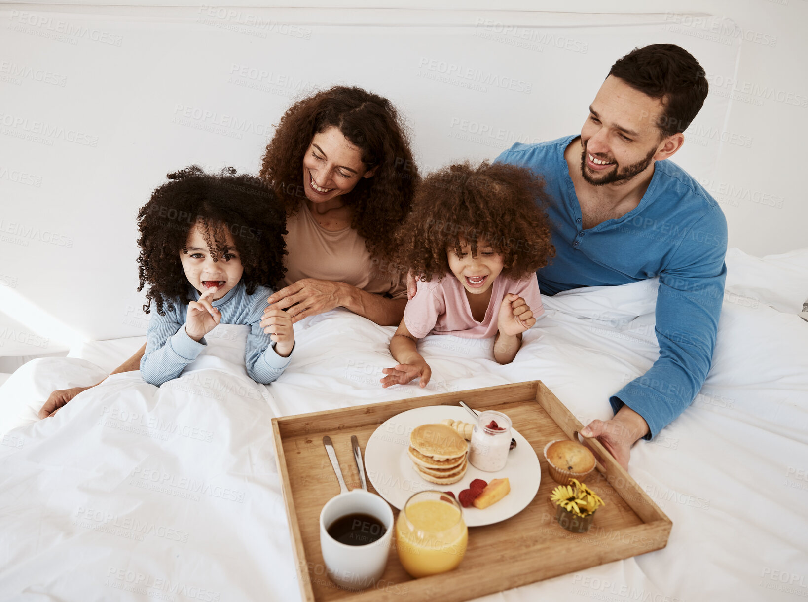 Buy stock photo Parents, kids and breakfast in bed, morning or excited for love, bonding or care on holiday. Mother, papa and children in bedroom, food and smile together for nutrition, eating and happy family home