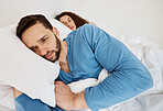 Divorce, fight and angry couple in bed after fight, discussion or frustrated by cheating wife at home. Bedroom, problem and man ignore annoyed woman with depression, anxiety or erectile dysfunction 