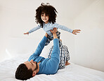 Flying, portrait and a child with a father in the bedroom for playing, happiness and bonding. Smile, house and a dad with a girl kid on the bed in the morning together for childhood and goofy