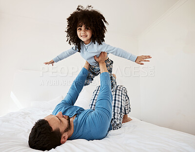 Buy stock photo Flying, portrait and a child with a father in the bedroom for playing, happiness and bonding. Smile, house and a dad with a girl kid on the bed in the morning together for childhood and goofy