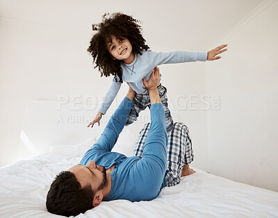 Buy stock photo Playing, portrait and a child with a father in the bedroom for flying, happiness and bonding. Smile, house and a dad with a girl kid on the bed in the morning together for childhood and goofy