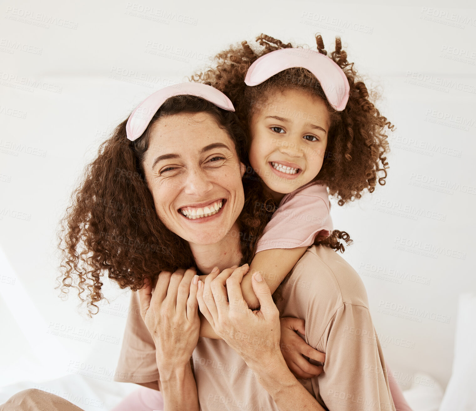 Buy stock photo Mother, daughter and sleep mask, portrait and bonding with love, care and happy in the morning. Woman, young girl and hug at home with pajamas and family, positivity and fun together in bedroom