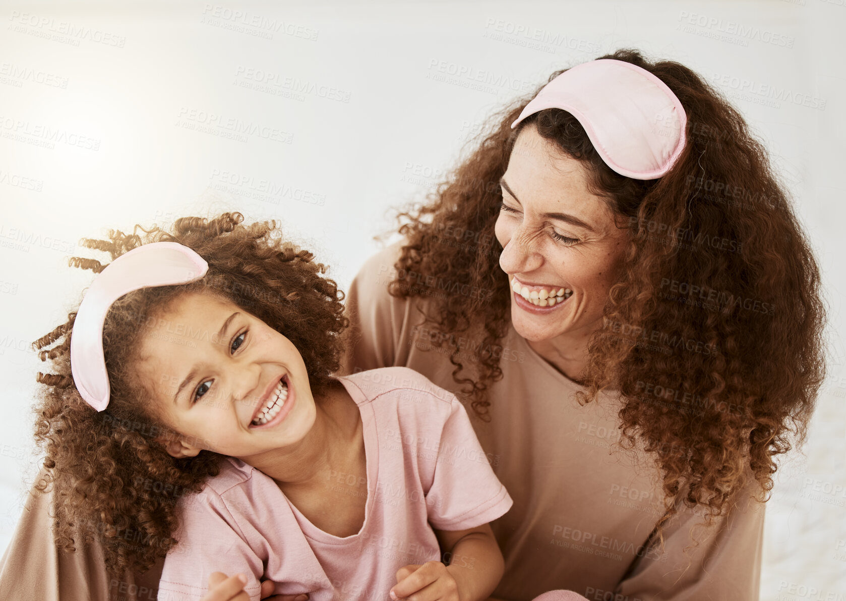 Buy stock photo Mother, daughter and sleep mask, happiness and bonding with love, care and laughter in the morning. Woman, young girl and smile at home with pajamas and family, positivity and fun together in bedroom