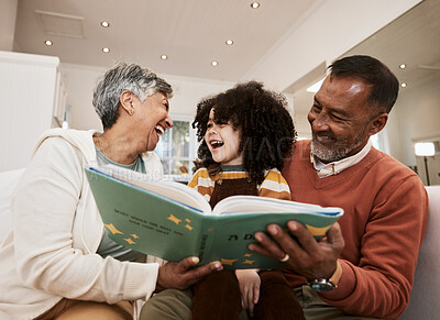 Buy stock photo Grandparents, kid and laugh for reading, book or home for support, learning or education with love. Senior man, woman and happy child for funny story, teaching or help for development in family house