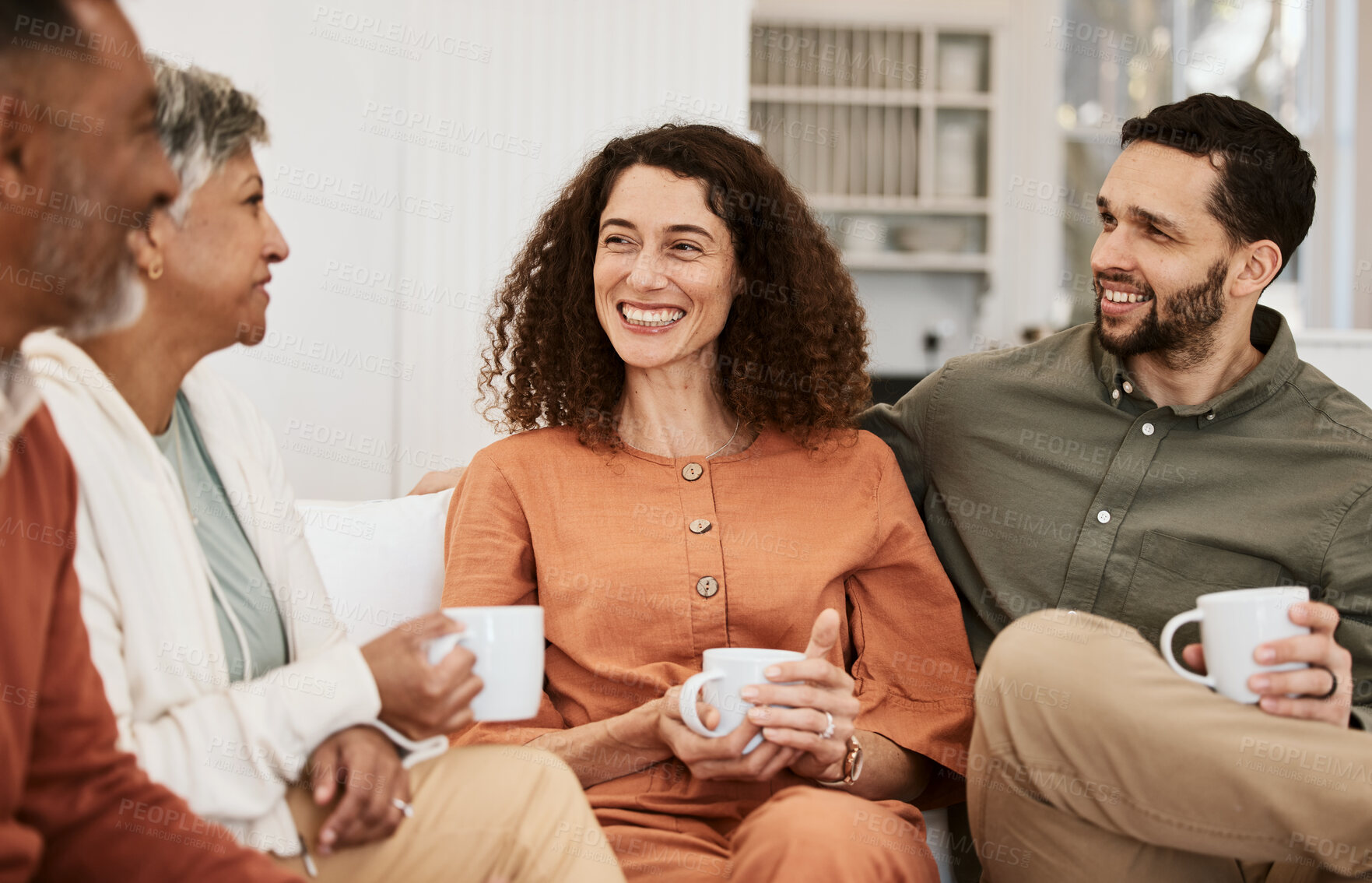 Buy stock photo Couple, senior parents and coffee on sofa, relax and happy with conversation, love and bonding in living room. Men, women and chat with matcha, espresso or tea for care, lounge couch and family home