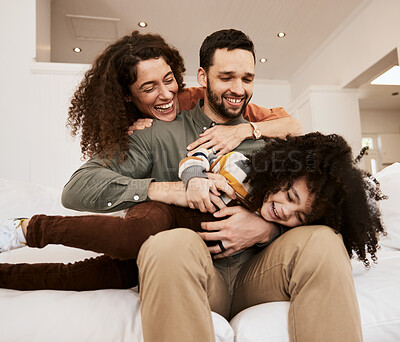 Buy stock photo Laughing, play and home child, mother and father having. fun, care and parents tickle young kid, relax and excited on apartment sofa. Funny comedy, love and bonding mama, papa or goofy family bonding