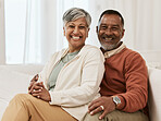 Happy, portrait and senior couple hug on sofa a living room relax, laugh and bonding in their home. Face, smile and old man embrace elderly woman in a lounge with love, satisfied and enjoy retirement