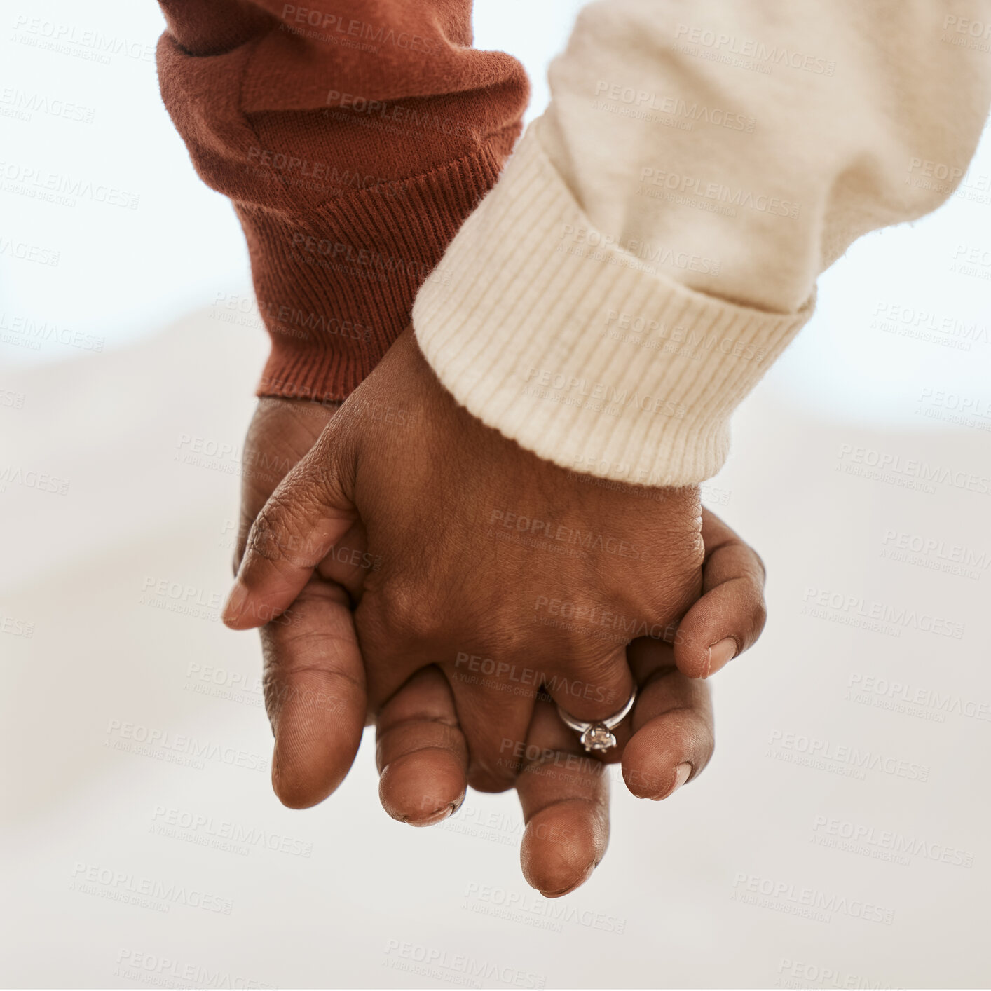 Buy stock photo Closeup, love and a couple holding hands for support, marriage trust and gratitude. Respect, comfort and a man and woman with affection, care or a gesture for romance together in a relationship