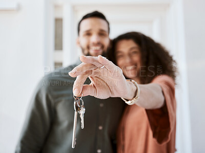 Buy stock photo Hand, house keys and couple face for real estate, success or mortgage goal together. New home, property and portrait of man with woman smile for investment, dream or financial security in living room