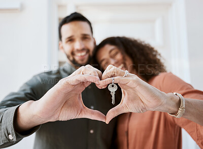 Buy stock photo Keys, heart and hands by couple hug for real estate, success or mortgage loan in new home together. Love, emoji and man with woman smile for thank you, emoji or realtor, property or dream house sale