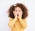 Child, shock and hands on face in studio for wow, surprise or announcement for sale or promotion. Face portrait of a young girl isolated on a white background with mouth open, news and omg emoji