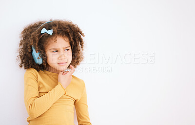 Buy stock photo Thinking, problem and child with headphones on white background for planning, solution or music. Mockup, stress and a girl kid with a podcast, radio or audio idea with space for listening information