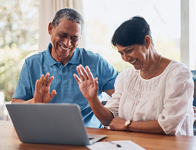 Buy stock photo Video call, wave and senior couple with laptop in a dining room together for communication. Happy, smile and elderly man and woman in retirement greeting for virtual conversation on computer at home.