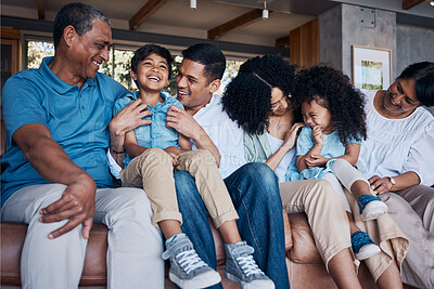 Buy stock photo Laughing, big family and on a home sofa for conversation, visit or bonding. Happy, together and parents, children and grandparents on a couch for a joke, comedy or communication in the living room