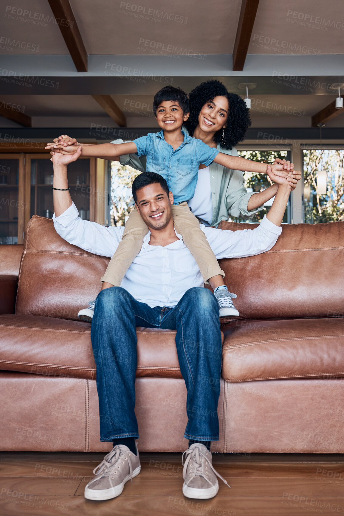 Buy stock photo Smile, airplane and portrait with family on sofa for happy, bonding or peace on holiday. Love, care and playful with parents and child in living room at home for vacation, cuddle and embrace together