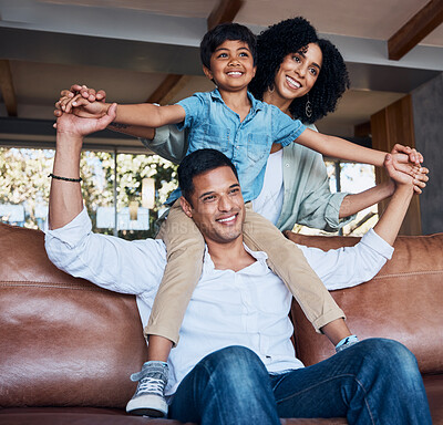 Buy stock photo Smile, airplane and relax with family on sofa for happy, bonding or peace on holiday. Love, care and playful with parents and child in living room at home for vacation, hug and fun together