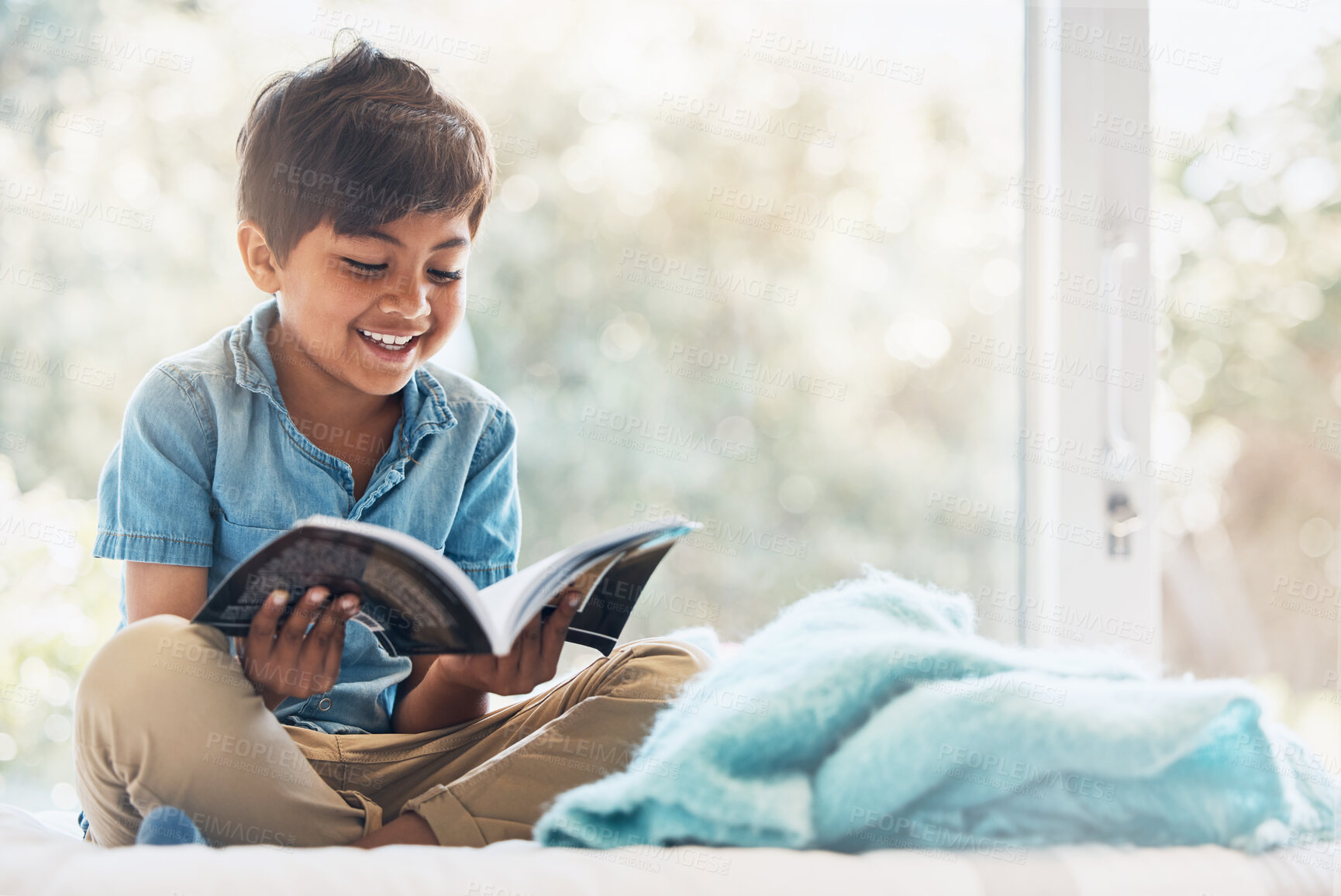 Buy stock photo Boy, child and reading book in bedroom for learning, language development or studying literacy. Happy young kid relax with books for storytelling, hobby and knowledge of literature, education and fun