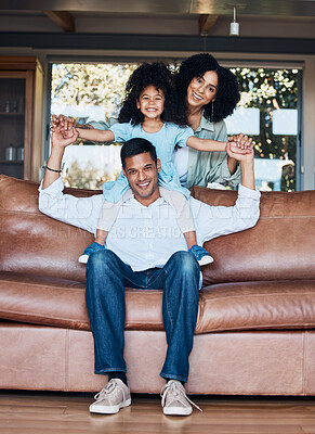 Buy stock photo Relax, airplane and portrait with family on sofa for happy, bonding or peace on holiday. Love, care and playful with parents and child in living room at home for vacation, cuddle and embrace together