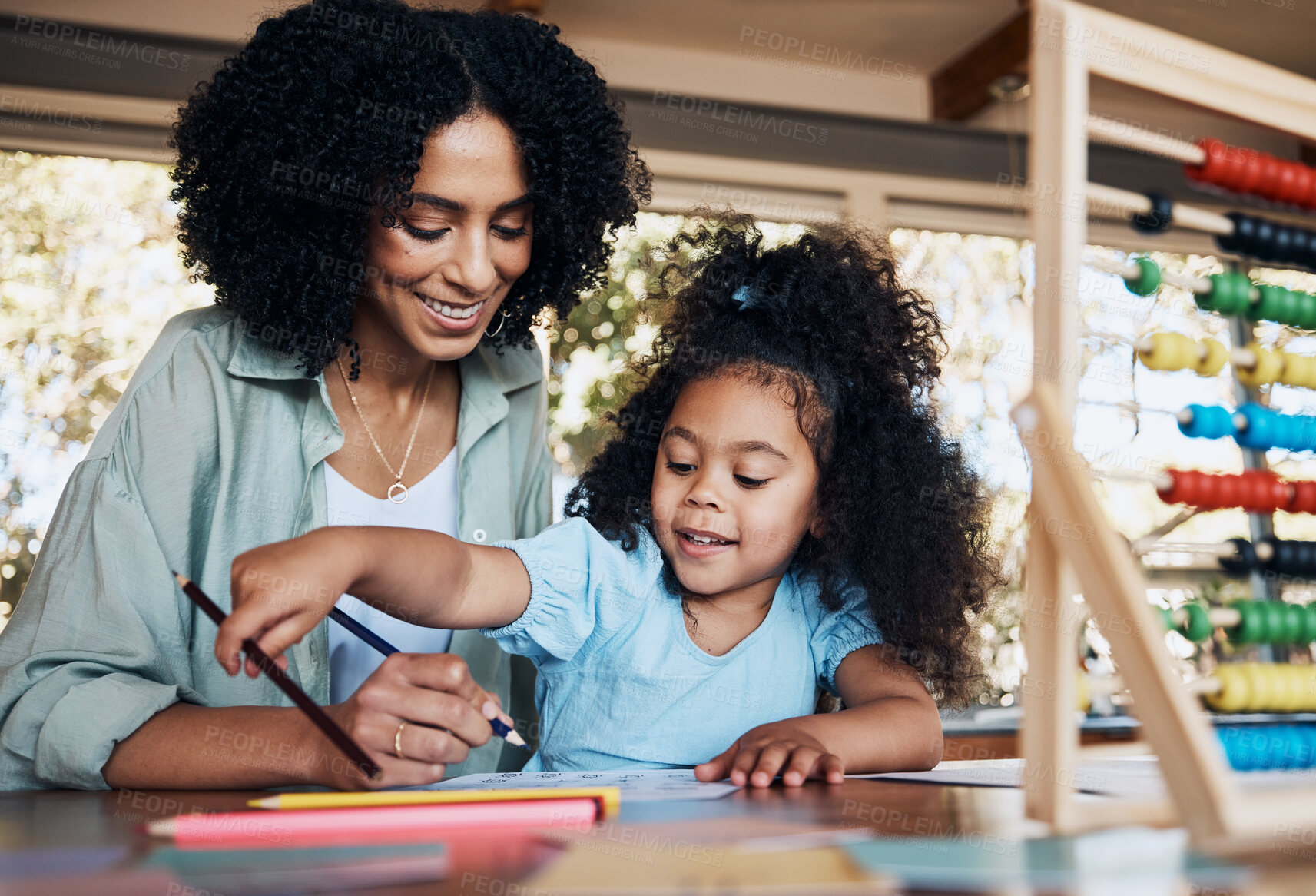 Buy stock photo Happy, writing and a mother with a child for homework, education support and together for teaching. Smile, family and a young mom with a girl kid for drawing, school project or studying in a house