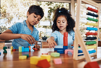 Buy stock photo Siblings, children and playing building blocks for development, learning and growth on table in kitchen. Family, boy and girl child with toys for education, math, numbers and creativity in house