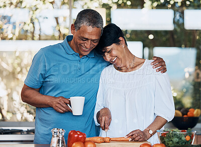 Buy stock photo Couple, love and hug while cooking food, cutting vegetables and prepare carrot for salad at home. Mature man, happy woman and embrace in kitchen while making healthy lunch, meal and diet for dinner 