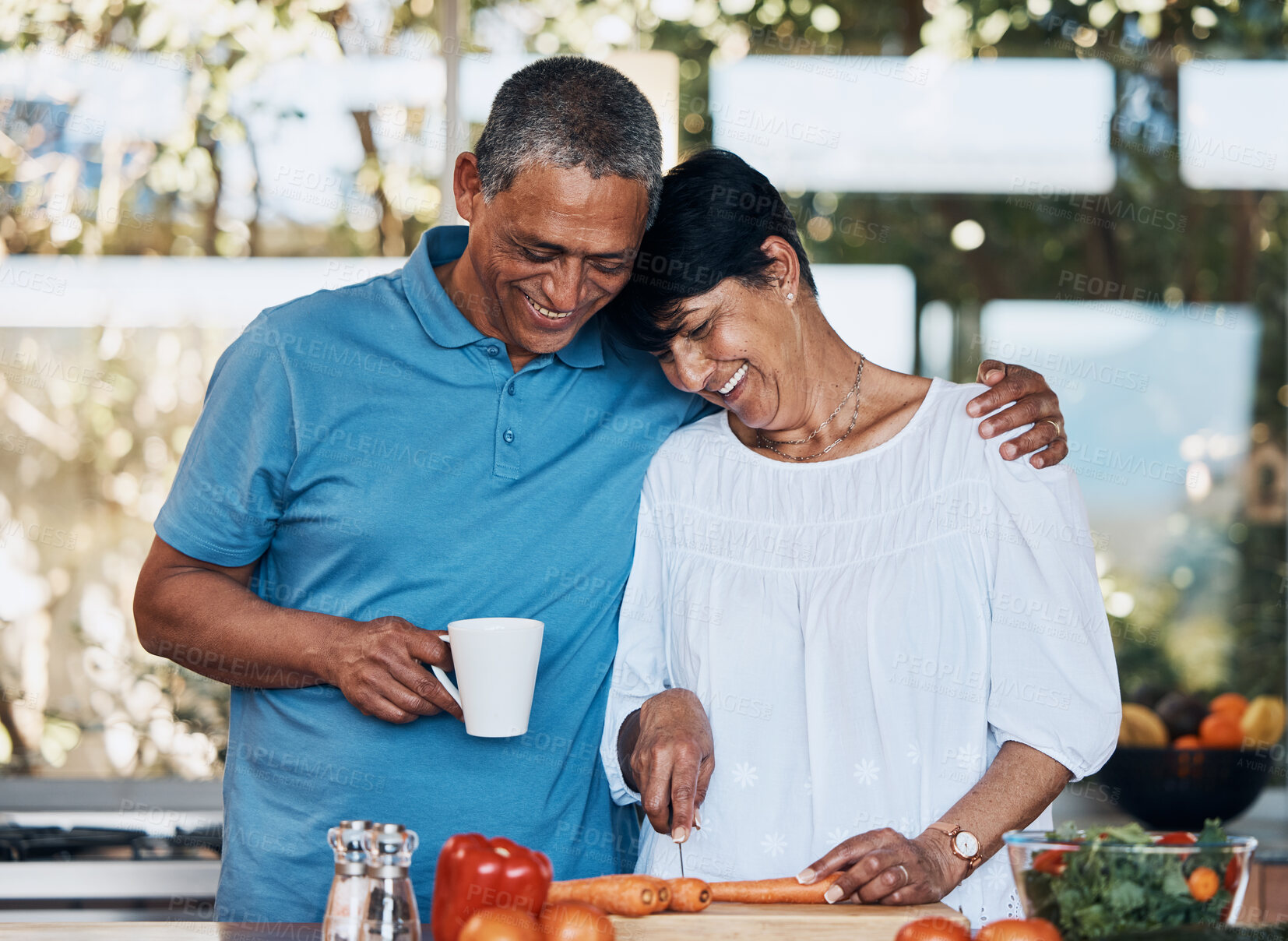 Buy stock photo Couple, love and hug while cooking food, cutting vegetables and prepare carrot for salad at home. Mature man, happy woman and embrace in kitchen while making healthy lunch, meal and diet for dinner 