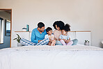 Happy, smile and family on bed talking, bonding and relaxing together with love at their home. Happiness, excited and young children speaking to their parents from Colombia in the room of their house