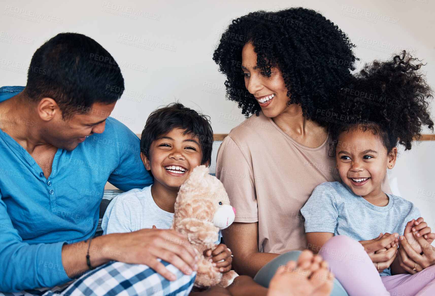 Buy stock photo Smile, love and children with their parents on a bed for bonding, connection or playing with toys. Happy, teddy bear and family from Colombia talking and relaxing in the room of their modern house.