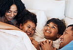 Family, funny and children laughing in bed at home in the morning together with their happy parents. Relax, love or smile with a mother, father and kids lying in a bedroom for weekend bonding